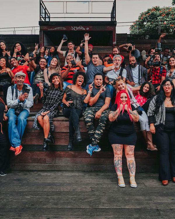 A diverse group of people smiling after a yoga session.